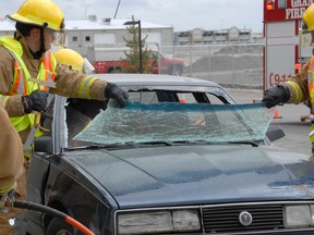 Eight new firefighters dismantled a late model Pontiac sedan during a series of training event last year. In 2014 the City and Country fire departments will jointly host The Alberta  Fire Chiefs Association conference, which will also feature some training. (DHT file photo)