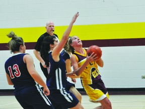 Shae Miller goes for a layup during Monday's game. (Kevin Hirschfield/PORTAGE DAILY GRAPHIC)