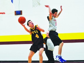 Trojans' Michael Lavallee goes for a layup. (KEVIN HIRSCHFIELD/PORTAGE DAILY GRAPHIC)