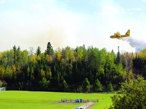 One of two CL-415 waterbombers and spotter aircraft deployed by the Ministry of Natural Resources to battle a wildfire in Kenora Sept. 12, 2012.
FILE PHOTO