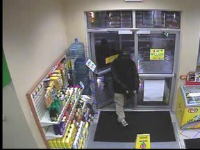 One of the robbery suspects entering the Shell gas station store on Keil Drive.