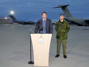Minister of National Defence Peter MacKay, centre and commanding officer of 8 Wing/CFB Trenton, Ont. hold a press conference to announce the departure of a C-17 Globemaster aircraft and 25 members of 429 Transport Squadron for a French Air Force base near Istres, France and then to Mali to assist French troops with transport capacity, Tuesday morning, Jan. 15, 2013.  JEROME LESSARD/The Intelligencer/QMI Agency