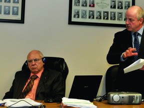 Augusta Township temporary acting treasurer Ray Morrison, right, speaks to township council while chief administrative officer Mike Larocque, left, listens. (RONALD ZAJAC/The Recorder and Times)