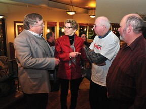 RYAN PAULSEN    Ontario Liberal Party leadership candidate Kathleen Wynne chats with local municipal politicians, Whitewater Region Reeve Don Rathwell, left, Deputy Mayor Izett McBride and Mayor Jim Labow, during a visit to Cobden on Jan. 12. This weekend, the party chooses the successor to Premier Dalton McGuinty.