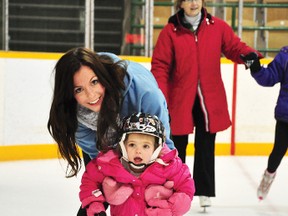 RYAN PAULSEN   Ashley Serre helps her two-year-old daughter Isla around the ice at the Petawawa Civic Centre during the Jp2g Family Skate, part of this year's Cabin Fever activities, on Sunday afternoon