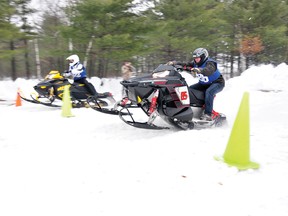 RYAN PAULSEN   Ethan Poirier, left, and Chris Hartwick speed off the start line at the 2013 Petawawa Snow Drags competition on Saturday.