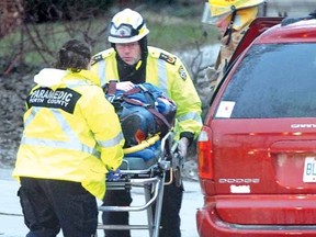 CARING FOR THE INJURED
SCOTT WISHART The Beacon Herald
Perth County paramedics along with Stratford Fire Department firefighters and Stratford Police responded to a two-vehicle collision at the intersection of Matilda and Huron streets Monday morning.