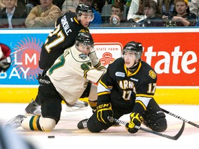 Iroquois Falls native Ryan Kujawinski, right, shown in action with the Sania Sting during an Oct. 30, 2011, OHL game against the London Knights is ranked 69th by the NHL’s Central Scouting Bureau heading into the 2013 NHL Entry Draft in June.