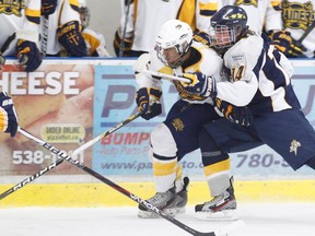 Grande Prairie Boston Pizza Storm Bailey Gagne ties up a St. Albert’s Flyer player during an AMMHL game at the Coca-Cola Centre Saturday. The Storm lost 8-2. (Randy Vanderveen/Special to Daily Herald-Tribune)