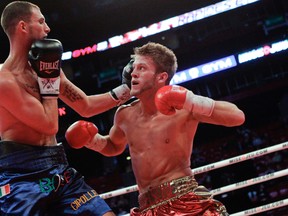 Kingston featherweight boxer Tyler Asselstine, right, fights Nicola Cipolleta at the Bell Centre in Montreal in February 2012. Asselstine’s next bout is Feb. 8 at the Bell Centre. (QMI Agency file photo)