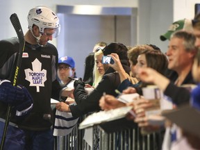 Maple Leafs defenceman Cody Franson signs autographs at the MasterCard Centre after his first skate of the lockout-shortened training camp, Jan. 15, 2013. (JACK BOLAND/Toronto Sun)