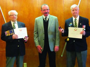 Keith Hutchinson and Bill Pearcy received the Queen's Diamond Jubilee Medal from deputy mayor at the Royal Canadian Legion in Portage la Prairie, Tuesday night. (ROBIN DUDGEON/PORTAGE DAILY GRAPHIC/QMI AGENCY)