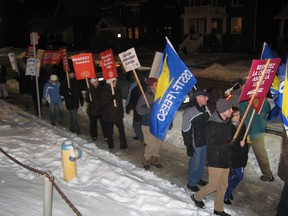 About 50 members of the Canadian Union of Public Employees, Ontario Secondary School Teachers Federation, Elementary Teachers Federation of Ontario and other trades unions rallied in front of Royal Canadian Legion Branch 23 on First Avenue Tuesday night to protest Bill 115. Inside, Nipissing MPP Vic Fedeli was hosting a town hall meeting on energy. A release from the North Bay and District Labour Council said workers are under assault by the Liberal government and they want Fedeli to help facilitate the process to repeal Bill 115.