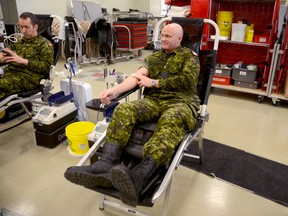 Lt. Terry Wynn donates blood for the first time this year, at a Canadian Blood Services donor clinic at CFB Trenton Monday morning. 
Emily Mountney Trentonian