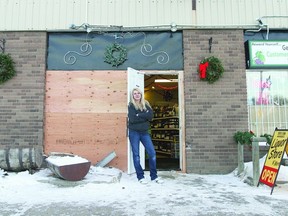 Karien Rempel, owner of Millet Liquor Store N’ More, stands in the newly built, temporary doorway of her store during this file photo taken earlier this month. Wetaskiwin RCMP believe the same thief who hit the store on Boxing Day, returned Jan. 12. This time he got away with $1,000 in booze.