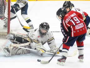 Quinte West Minor Peewee Hawks' goalie Daniel Nelson makes a spectacular save on Oshawa Generals' Aiden Reilly-Smith during the Hawks' 2-1 win Sunday at the Community Gardens.