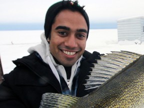 ‘Birthday boy’ Tony O’Brien celebrates his 22nd along with his first pickerel, lifetime Monday, January 7, 2013 on the frozen surface of Lake Nipissing. Jeff Tribe/Tillsonburg News