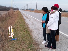 Family and friends of Gerald Plain, including his sister Marie Simcoe, niece Marina Plain and great-niece Richelle Ritchie, gathered on LaSalle Line near Sarnia, Ont., on Tuesday, Nov. 20, 2012, where the 64-year-old man was struck and killed. TARA JEFFREY/THE OBSERVER/QMI AGENCY