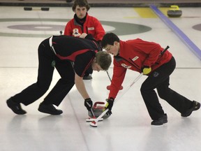 Michael Roy watches his front end of Jordan MacKenzie, left, and Mac Lenton go to work on a rock during the junior provincial curling championships in Edmonton on the weekend. Roy’s Airdrie Curling Club rink fell 5-4 in the final to Edmonton’s Thomas Scoffin foursome.

PHOTO SUBMITTED