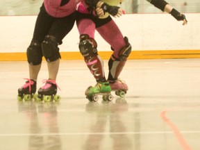 Sarah Hissett, right, and Sarah Deveau of the Rocky View Rollers Roller Derby Association, battle during a practice last year at the Pete Knight Arena in Crossfield. The Association is holding an open house at 7 p.m. on Jan. 17 at Genesis Place to recruit new players.
CHRIS SIMNETT/AIRDRIE ECHO FILE PHOTO