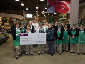 Staff from the Sobeys Airdrie store present Airdrie Food Bank executive director Lori McRitchie with a $10,000 cheque on Monday.
JAMES EMERY/AIRDRIE ECHO