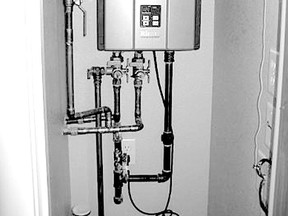 The tankless water heater is designed to be a space-saving product for use in a smaller new home.  The touch-screen thermostat, above, reverts to a screen saver when not in use to blend in with your home’s decor. Some models can even be used as digital picture frames.