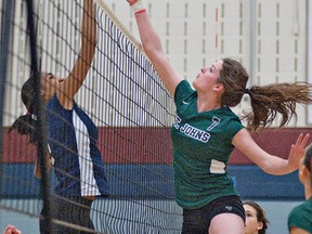 BRIAN THOMPSON, The Expositor

Skylar Turkiewicz (right) of the St. John's College attempts to spike the ball past Melaiya Grappie of the Assumption College during a senior girls high school volleyball exhibition game on Wednesday at Assumption.