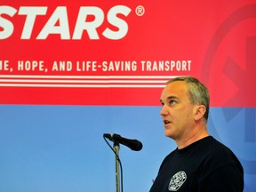 Robert Bennett explains the importance of STARS Air Ambulance at the STARS 2013 Lottery launch at the Grande Prairie Kia, Wednesday. Bennett was viciously attacked by a grizzly bear in the Swan Hills area last September. He attributes STARS to saving his life. (Aaron Hinks/Daily Herald-Tribune)