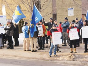 STEPHEN UHLER   Renfrew County public school teachers and their supporters picket Wednesday along Mary Street, protesting Bill 115 and how it was used to impose contracts upon them earlier this year. They were targeting MPP John Yakabuski for voting in favour of the legislation.