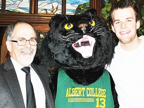 Albert College Head of School, Keith Stansfield, and Grade 12 student, Danny Manning, flank Paws the Panther, the institution's new mascot, unveiled during a recent introduction ceremony. (Photo submitted.)
