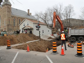 A crew spends Thursday, Jan. 17, 2013 on William Street near the corner of Grand River Street North in Paris, Ontario installing new connections to the water main for a local business, causing a temporary obstruction of traffic. Work should be completed and the full flow of traffic restored on Friday. MICHAEL PEELING/THE PARIS STAR/QMI AGENCY