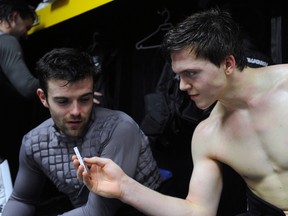 Sarnia Sting defenceman Josh Chapman, right, interviews goaltender J.P. Anderson after practice at the RBC Centre in Sarnia, Ont. on Wednesday, Jan. 16, 2013. (PAUL OWEN, The Observer)