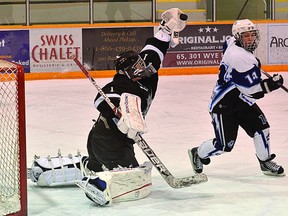 Sherwood Park Midget AAA Kings goalie Trevor Martin plucks a puck out of mid-air in a recent game against the Maple Leaf Athletic Club a the Sherwood Park Arena. The Kings are 2-0-1 to start the 2013 portion of the season. Photo by Michael Di Massa/Sherwood Park News/QMI Agency