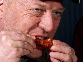 Tom Holmes of Wingdocs tries out a chicken wing at J.A.K.K Tuesdays on Thursday evening. 
Ian MacAlpine The Whig-Standard