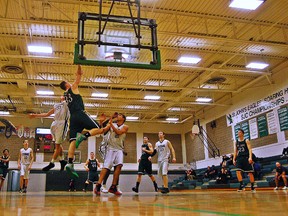 DARRY G. SMART, The Expositor

Jake Brennan of St. John's finishes with a one-handed dunk Wednesday night in exhibition high school basketball action against Simcoe's Holy Trinity.