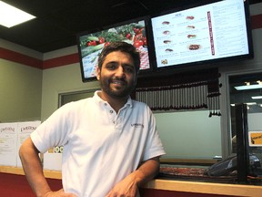 Syed Zaidi inside the Limestone Kabob House at the corner of Gardiners Road and Princess Street. (Michael Lea/The Whig-Standard)