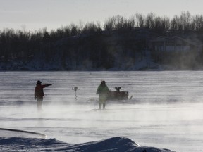 Workers from Candu Engineering Construction Ltd. flood the ice surface for the skating path on Ramsey Lake in this file photo. JOHN LAPPA/THE SUDBURY STAR