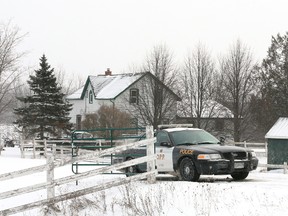 A Grey County OPP detachment cruiser is parked at the entrance to a property on Grey County Road 18 south of Woodford on Jan. 18, 2013. David Myles Brinton was sentenced in the Superior Court of Justice to six years in prison Tuesday, after pleading guilty Oct. 6 to manslaughter in the death of Robert Lawrence Hampson, who lived at this rural property.