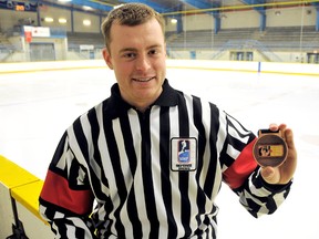 Pat Myers of Pain Court received a bronze medal for refereeing the third-place game at the 2013 World Under-17 Hockey Challenge. (DIANA MARTIN/The Daily News)