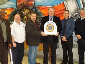A new Public Access Defibrillator (PAD) was installed at SCITS high school this week. Pictured are Andrew Taylor, general manager, Public Health Services, County of Lambton; Jon Cann, Public Access Defibrillator Coordinator, County of Lambton; Todd Case, Warden, County of Lambton; Sean Keane, Principal.; Patrick Armstrong, Rescue 7; Jeff Brooks, Manager, Emergency Medical Services Department, County of Lambton. SUBMITTED PHOTO/FOR THE OBSERVER/QMI AGENCY