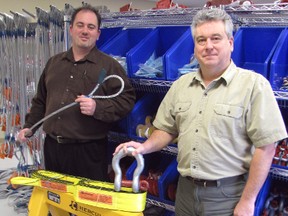Hercules SLR opened Jan. 7 and sells rigging-related items to the construction, crane, oil and gas industries. Technical sales rep Ed Schroeyers, right, runs the Duff Street store and warehouse and is pictured with the company's Ontario sales manager Kane Butcher. CATHY DOBSON/ THE OBSERVER/ QMI AGENCY