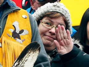 Attawapiskat First Nations chief Theresa Spence waves during a press conference on Victoria Island in the Ottawa River next to Parliament Hill in Ottawa Jan 4, 2013 in Ottawa, ON. (QMI Agency/ANDRE FORGET)