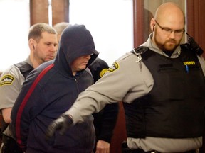 Jeffrey Paul Delisle leaves the courtroom after his bail hearing at the provincial court in Halifax, Nova Scotia March 30, 2012. (REUTERS/Sandor Fizli)