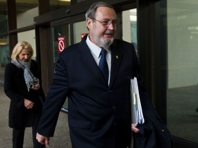 Edmonton-East MP Peter Goldring enters the court house after speaking to the media outside the court house in Edmonton, Alta. on Friday, Nov. 16, 2012. Goldring was charged with refusing a breathalizer in an incident that occurred on Dec. 4, 2011. Codie McLachlan/Edmonton Sun/QMI Agency