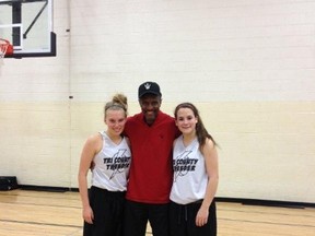 Jerika Baldin and Abby Heron pose with Toronto Raptors coach Dwane Casey following a surprise visit from the coach at a Tri-County Thunder practice. (Submitted Photo)