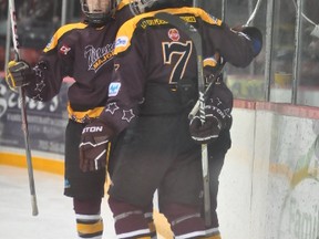 The Timmins Majors defeated the Kirkland Lake Legion 87's 10-3 on Friday at the McIntyre Arena. Majors skaters Andrew Boucher and Kevin Guertin (7) congratulate Troy Columbus on his goal in the second period.