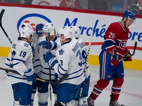 The Toronto Maple Leafs celebrate after scoring one of their two goals before a 2-1 win over the Canadiens in Montreal, Jan. 19, 2013. (QMI Agency)