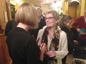 Liberal leadership hopeful Kathleen Wynne, MPP Don Valley West, right, speaks with Mary Ann Alton Saturday night at a campaign stop in Neustadt.