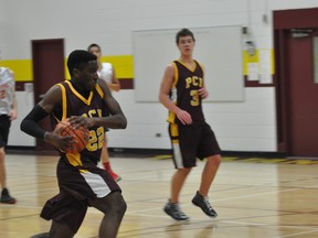 Trojans' Keith Appah drives to the hoop during a game last week. (Kevin Hirschfield/PORTAGE DAILY GRAPHIC/QMI AGENCY)