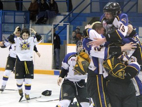 Joshua Byrne (19) gets on top of the pile as the Brampton 45's celebrate winning the Midget AA Silver Stick tournament Sunday, Jan. 20, 2013 at Clearwater Arena in Sarnia, Ont. (PAUL OWEN, The Observer)